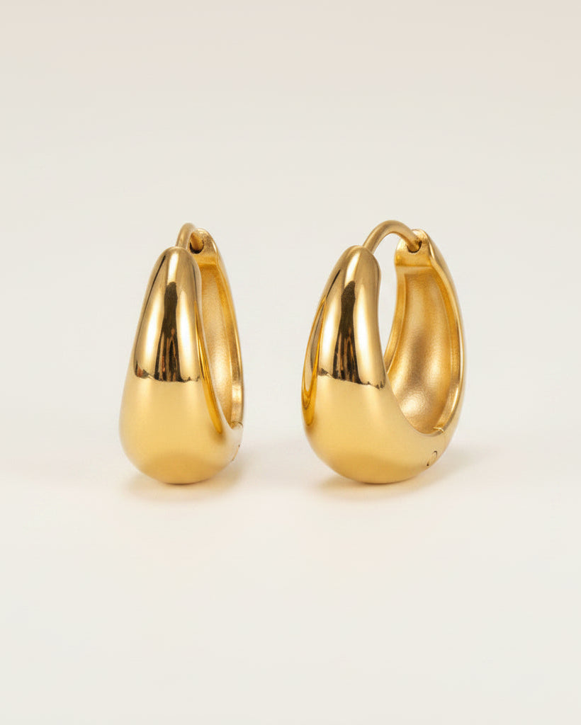 Gold hoop earrings with measurements and material information on a white background