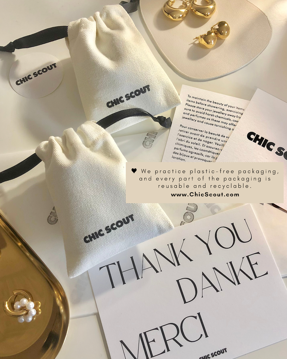 Chic Scout jewelry packaging with gold earrings and a 'Thank You' card on a white surface.